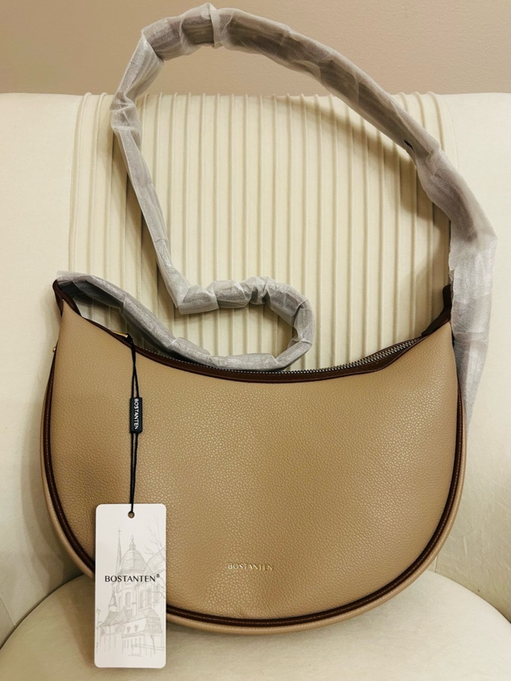 Bostanten Women's Shoulder Bag in beige with brown trim and strap.